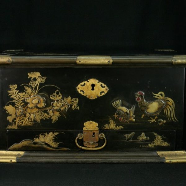 Chest decorated with branches and roosters